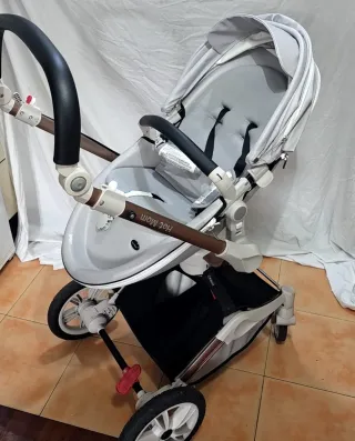 Carrito de bebé con capazo y accesorios