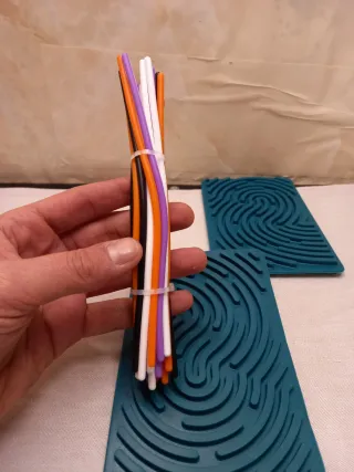 Gioco 2 tappetini impronte digitali + bastoncini