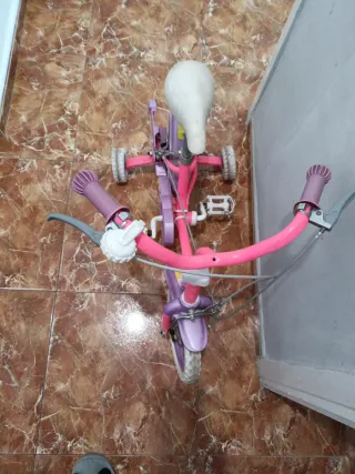 Bicicleta infantil rosa y morada negociables