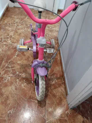 Bicicleta infantil rosa y morada negociables