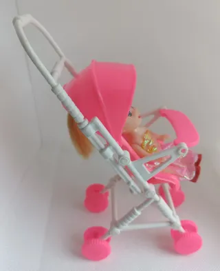 Lote muñecas, carrito y bici