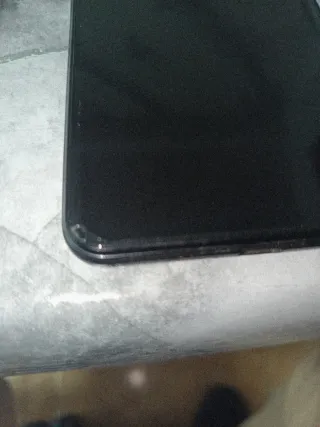 Pequeña picadura en pantalla se ve en foto