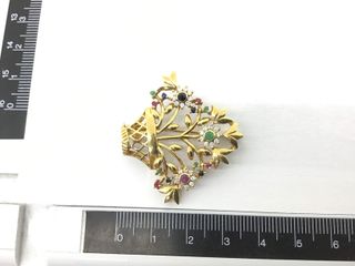 broche oro 18k con piedra