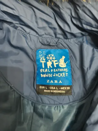 plumífero azul capucha.Necesita cambio cremallera