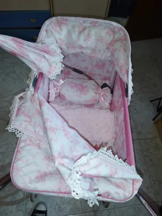 Cochecito de muñecas rosa