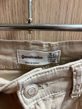 Tejano beige bajo deshilachado