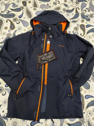 Chaqueta cortavientos Quechua azul y naranja