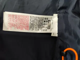 Chaqueta cortavientos Quechua azul y naranja