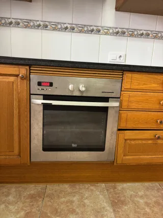 Cocina completa de madera y piedra