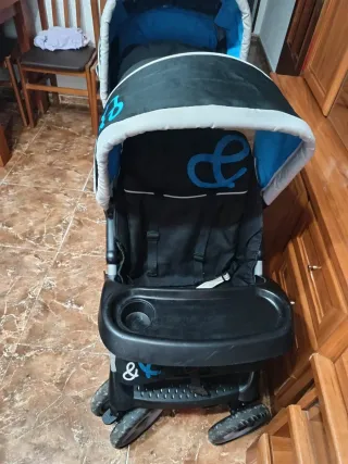 Carro gemelar plegable y con protector de lluvia