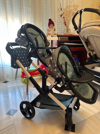 Carrito gemelar de muñecas con estrellas