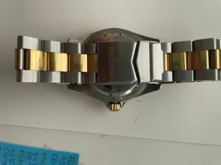 Reloj Delma bicolor oro y plata