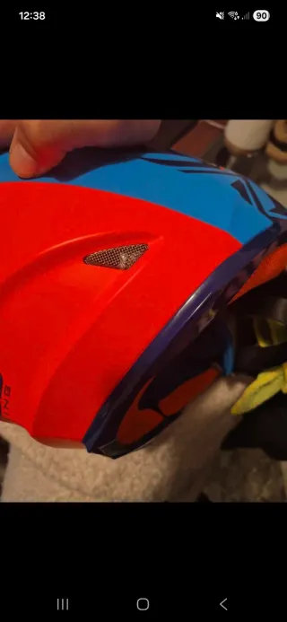 Casco Motocross Azul y Naranja fosforito.