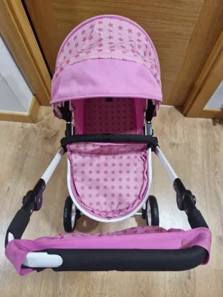 Carrito de muñecas rosa con estrellas