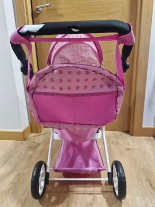 Carrito de muñecas rosa con estrellas