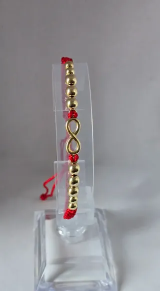 Pulsera infinito oro 18k y cordón rojo