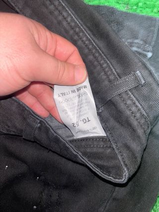 Jeans uomo neri strappati con zip