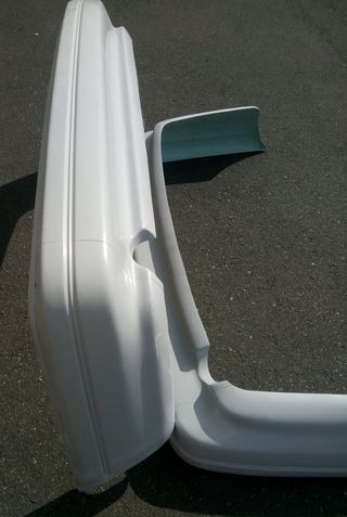 138-DEFENSA TRASERA FORD SIERRA COSWORTH