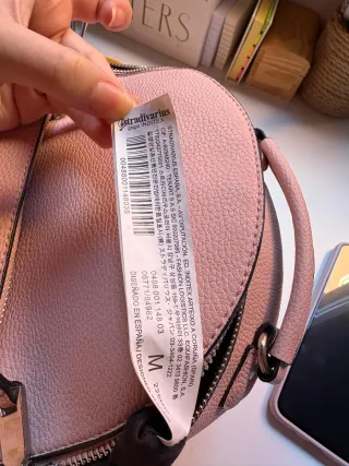 Mochila pequeña de hombros rosa