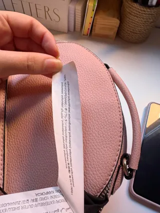 Mochila pequeña de hombros rosa