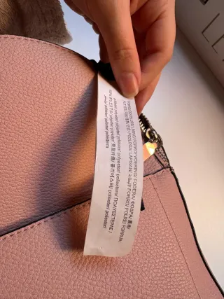 Mochila pequeña de hombros rosa