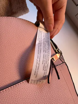 Mochila pequeña de hombros rosa