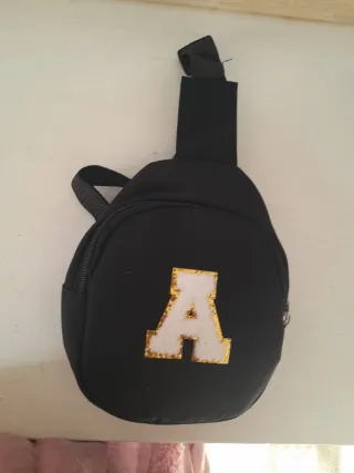 Conjunto riñonera y gorra negra