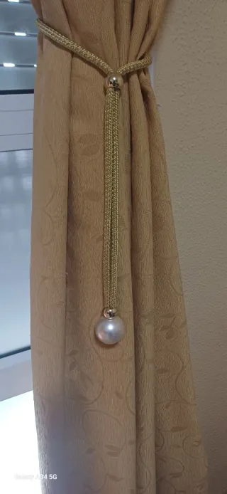 Sujetador de cortina dorado con perla