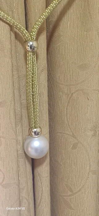 Sujetador de cortina dorado con perla