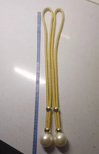 Sujetador de cortina dorado con perla