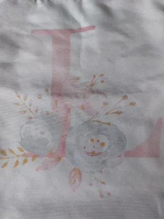 Bolsa de tela con letra L y flores