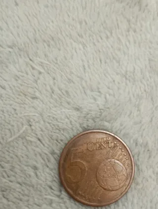 Moneta 5 cent. con difetto