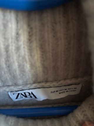 Jersey de punto gris cuello alto