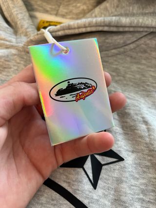 Sudadera Corteiz gris con estampado