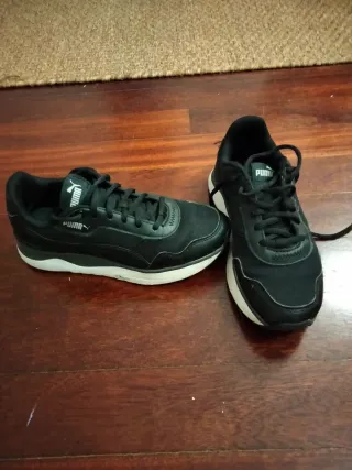 Zapatillas Puma niña negras y blancas