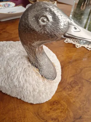 Anatra argento e spugna di conchiglia