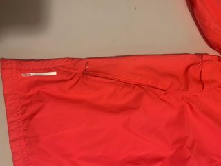 Cortavientos running Puma naranja neón