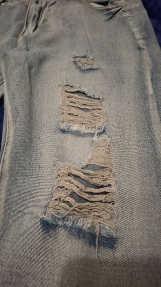 Pantalones Amiri Azules Rotos