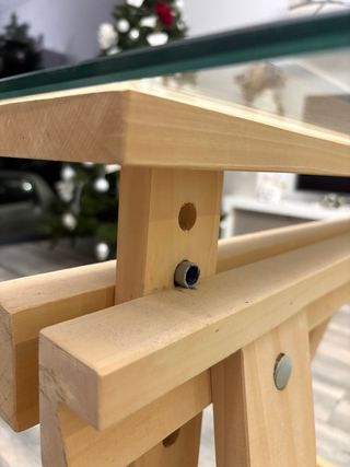 Mesa cristal 140x70 con caballetes madera