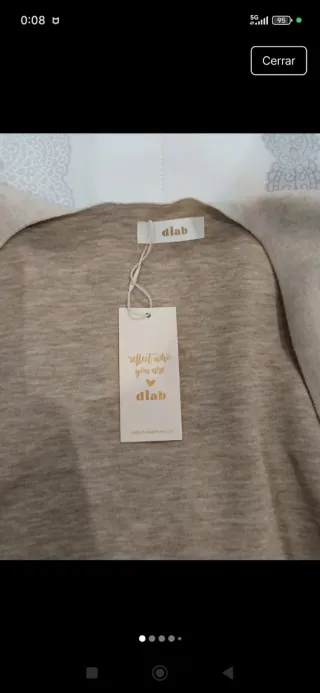 Capa poncho beige con nudo y flecos