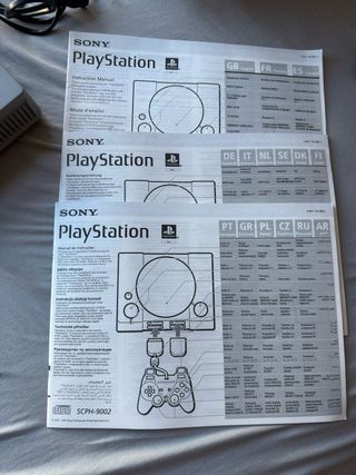 PlayStation 1 con caja y cable