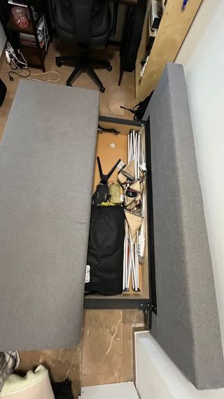 Sofá cama gris de tela