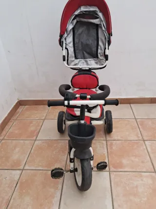 Triciclo infantil con capota y cesta