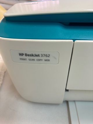 Impresora HP pequeña verde y blanca