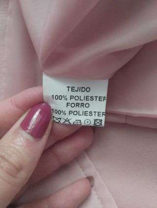 Traje de chaqueta rosa palo.