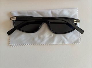 Óculos Miu Miu Pretos