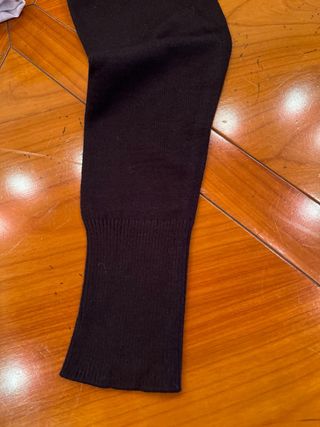 Jersey de punto negro con botones, usado 1 vez