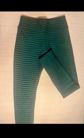 Leggings verde oscuro con detalles