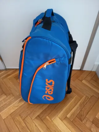 Paletero Asics azul y naranja