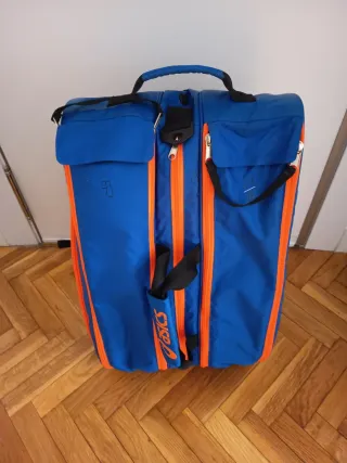 Paletero Asics azul y naranja